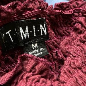 two burgundy crop top